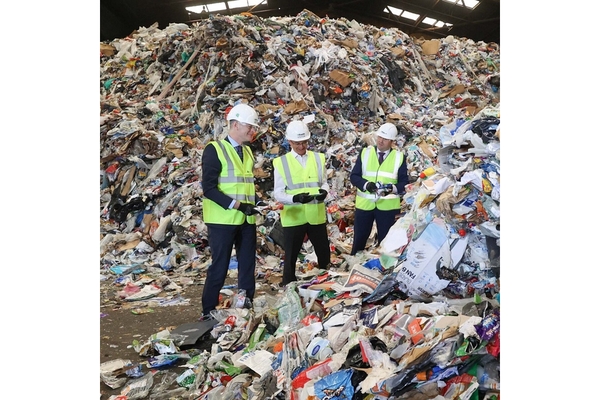 Workers in paper recycling factory.